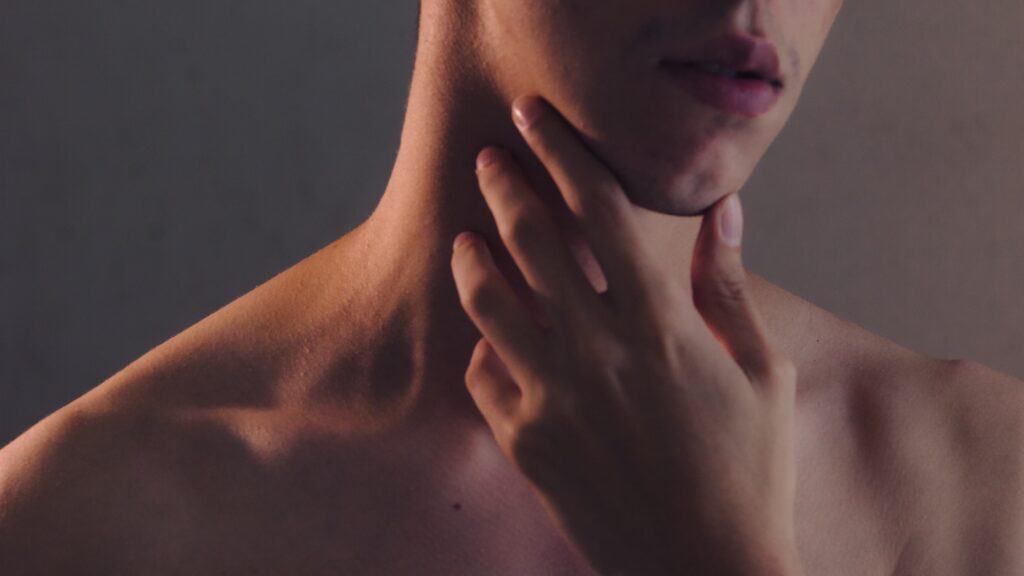 Thyroid, woman pointing to neck